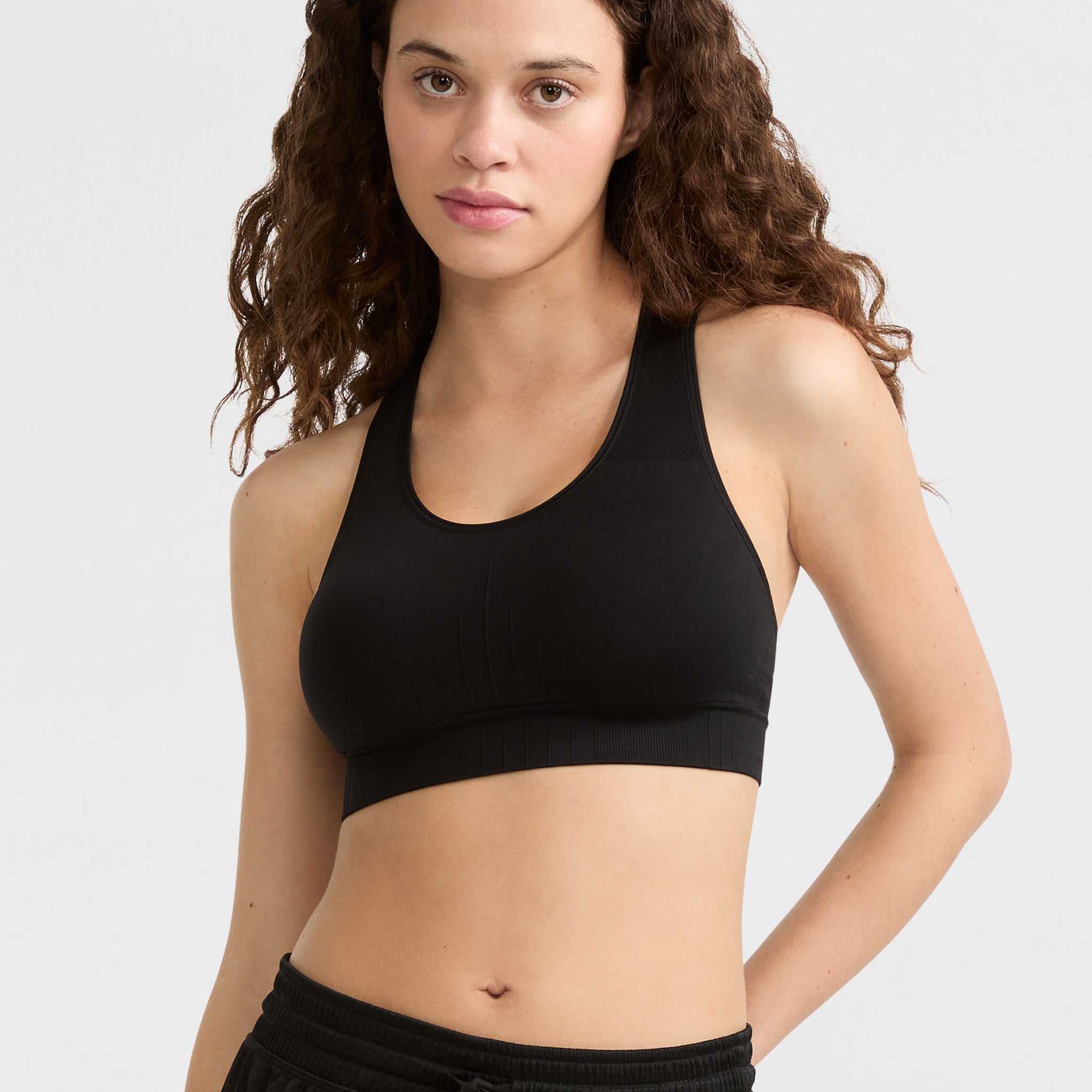 Seamless Racerback Sports Bra for Workouts & Yoga | Infinity C Logo